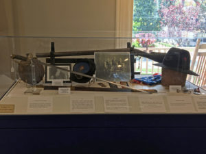 Civil War sword and hat in a display case